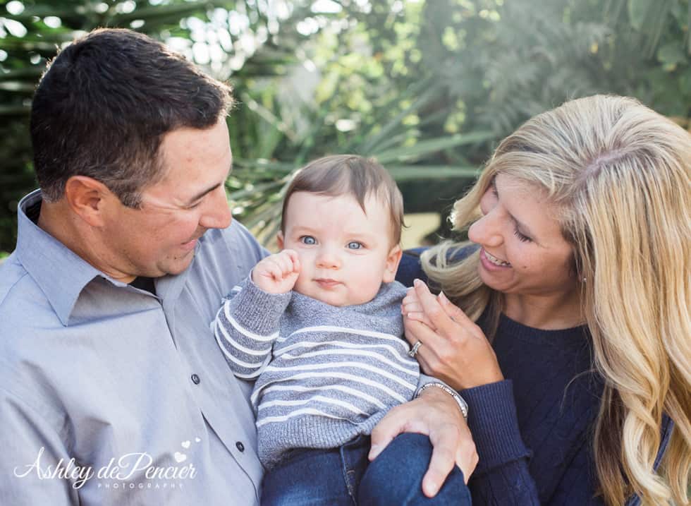 Mom and dad holding their six month old boy