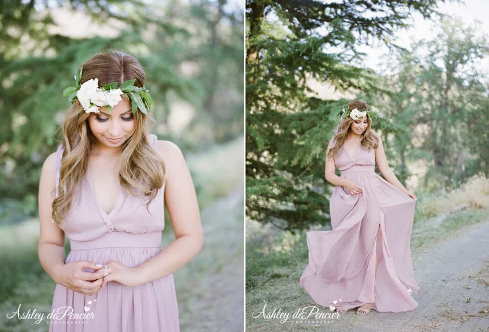 A woman wearing a flower crown and long flowy dress