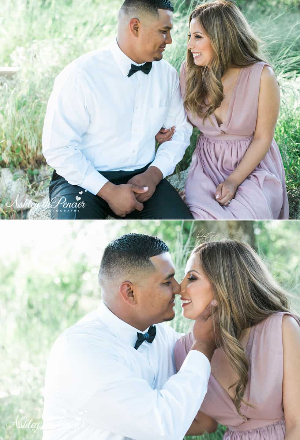 An engaged couple sitting together outside