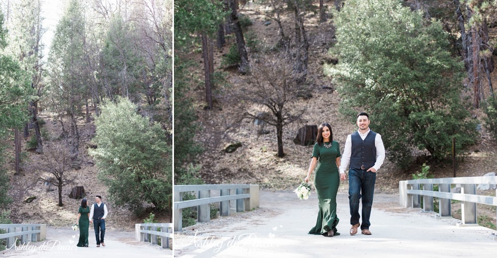 A couple strolling along a bridge