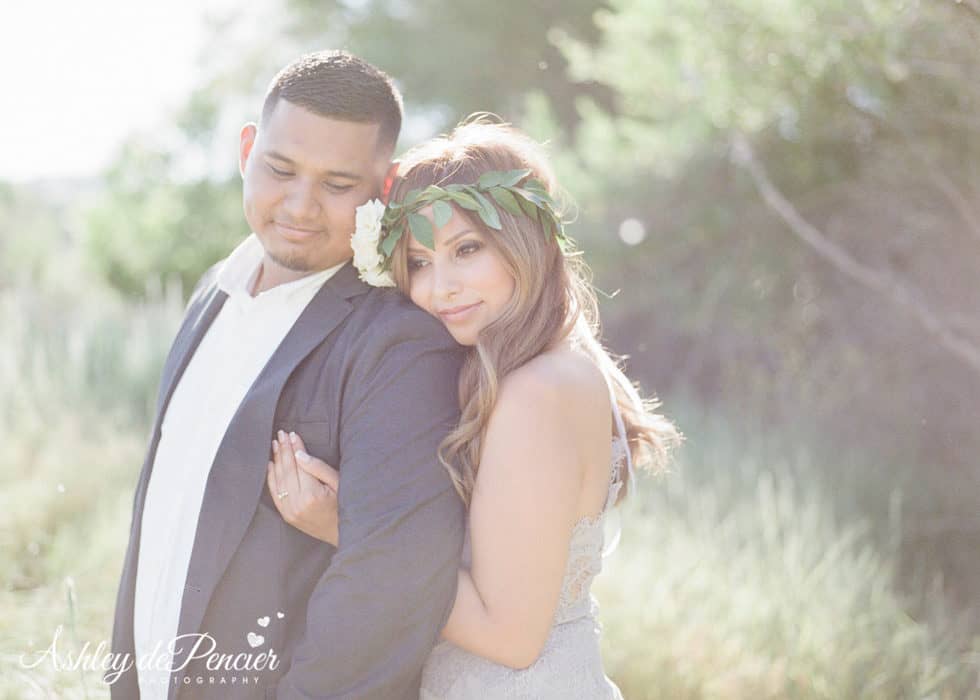 A woman leaning on her fiance's shoulder