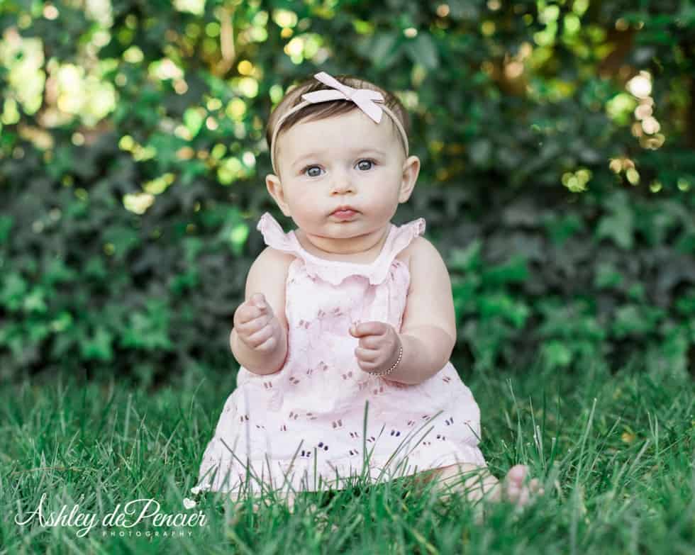 Little girl sitting outside