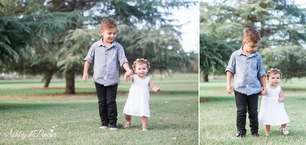 two children playing in the grass