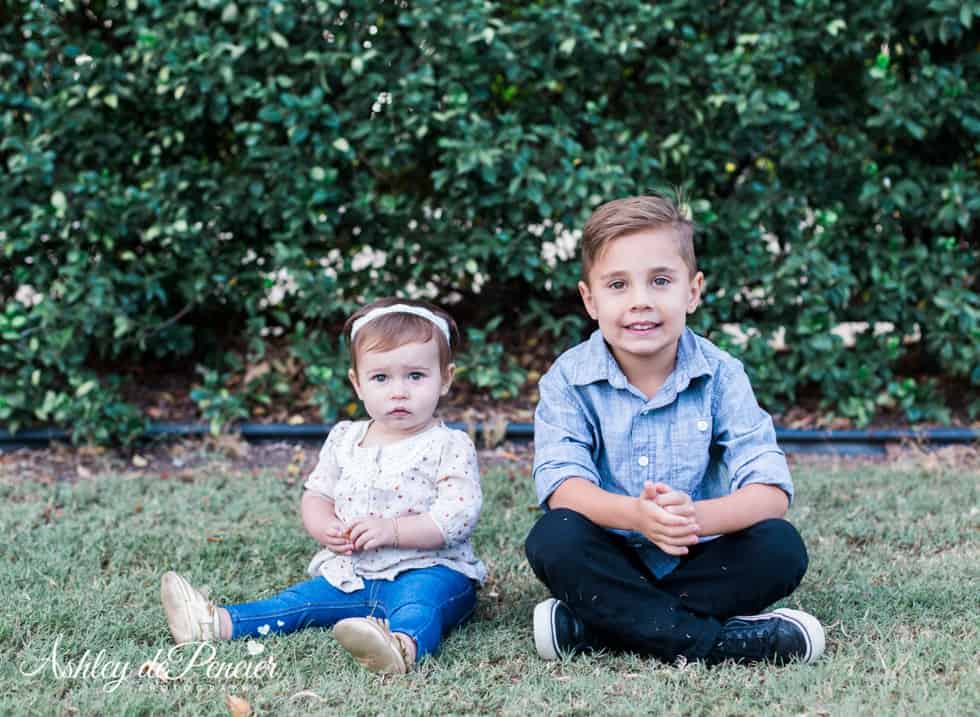 boy and girl sitting outside