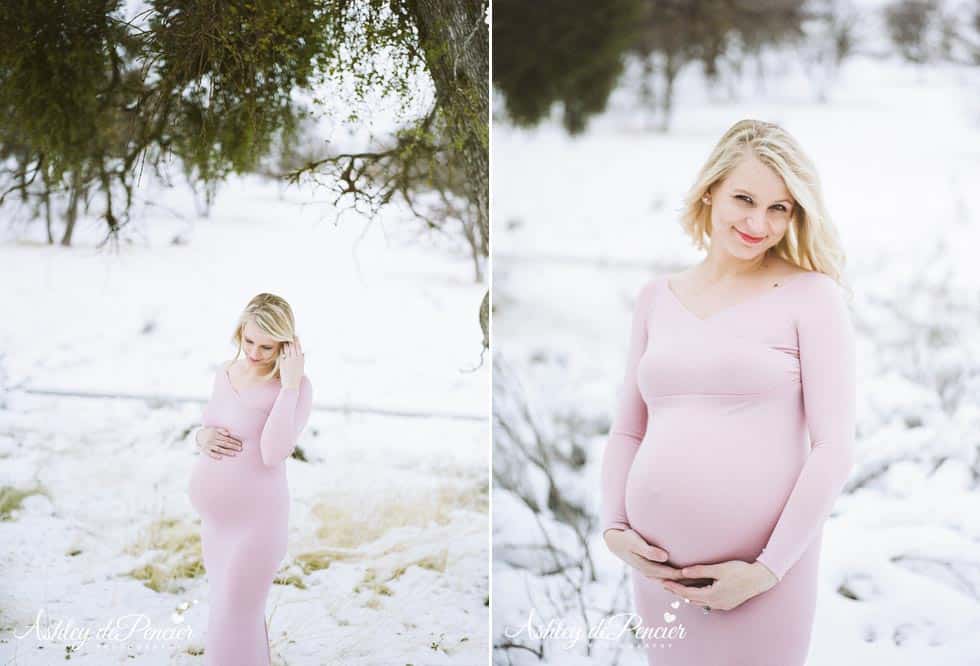 Pregnant woman in pink dress standing outside