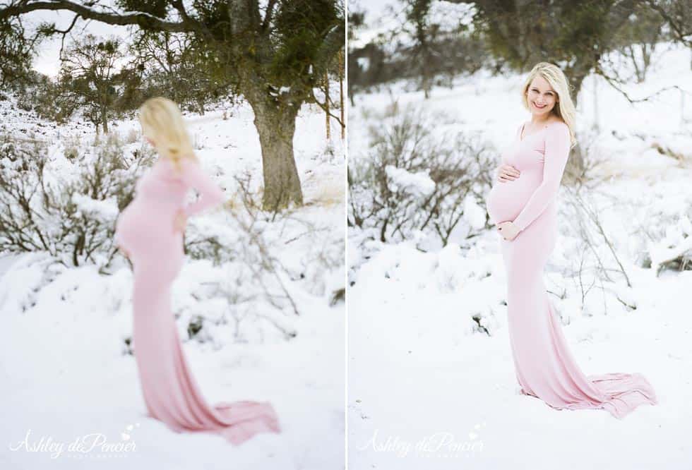 Beautiful blond pregnant woman standing in the snow