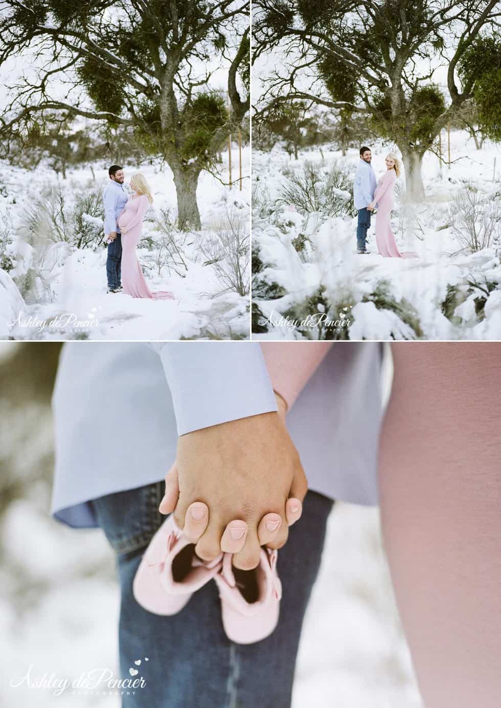 Man and woman standing in the snow holding hands