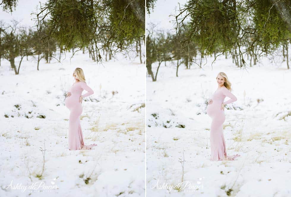 Pregnant lady standing in the snow in a pink dress