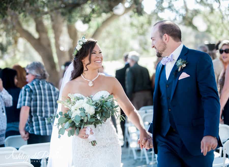 Bride and groom walking down the aisle