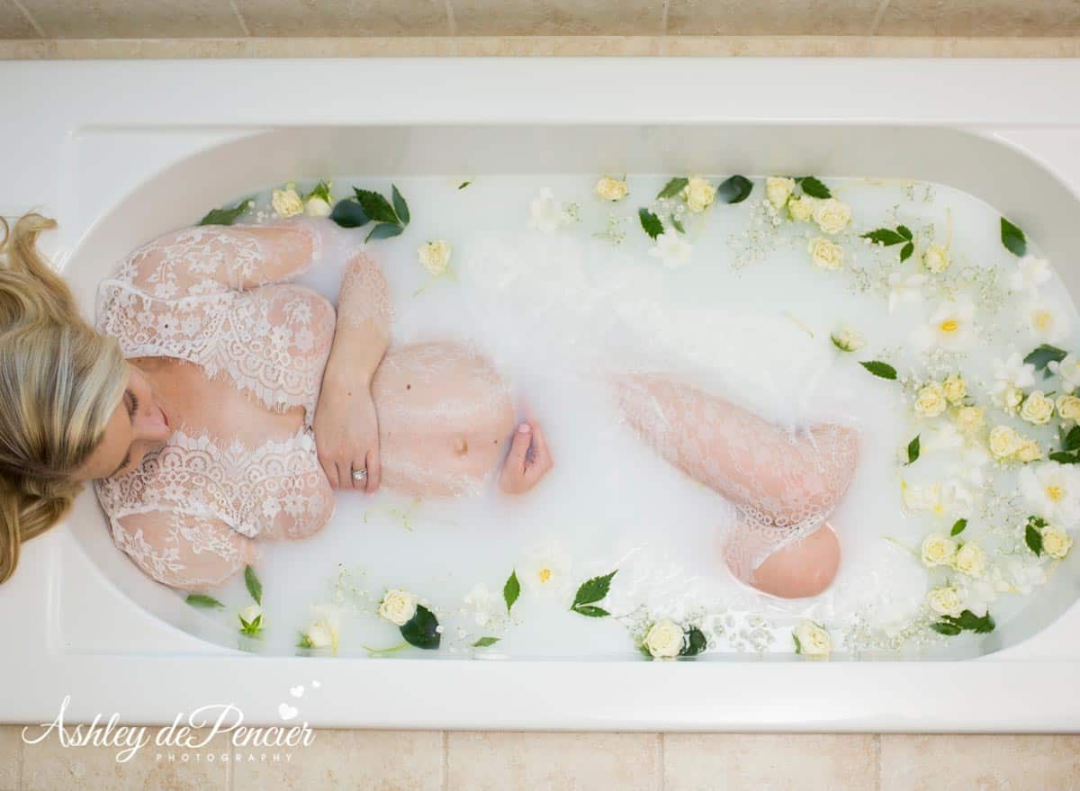 a woman lying in a milk bath