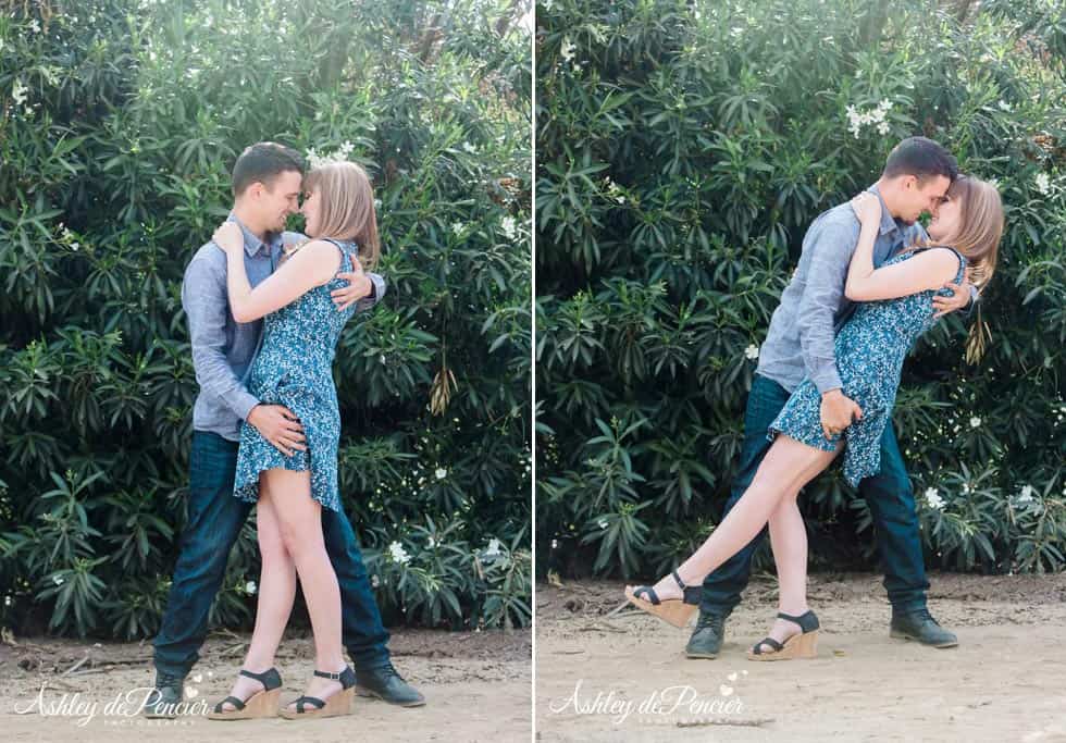 a man dipping his fiance and kissing her